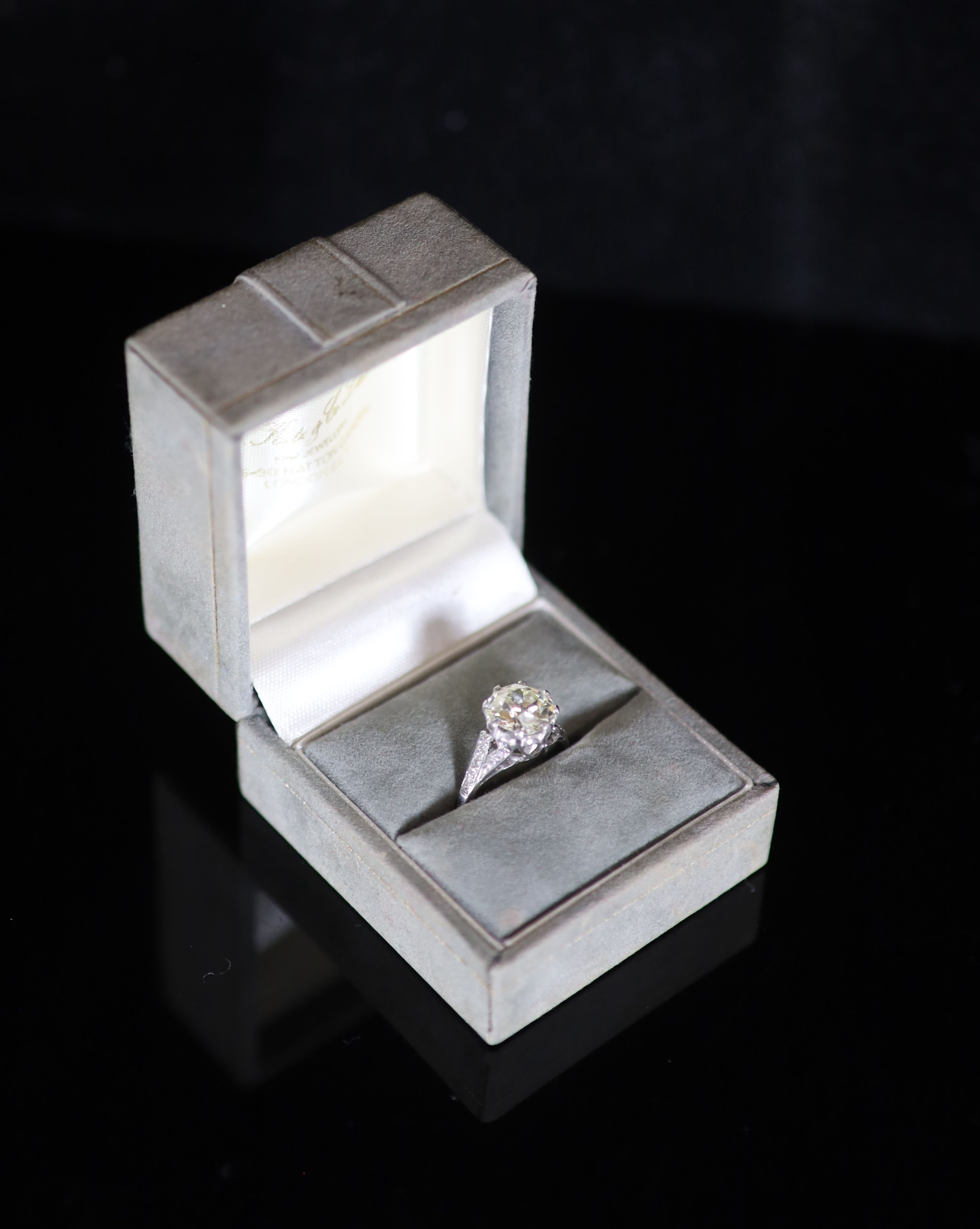 A 20th century 18ct white gold and platinum set single stone diamond ring, with diamond set shoulders